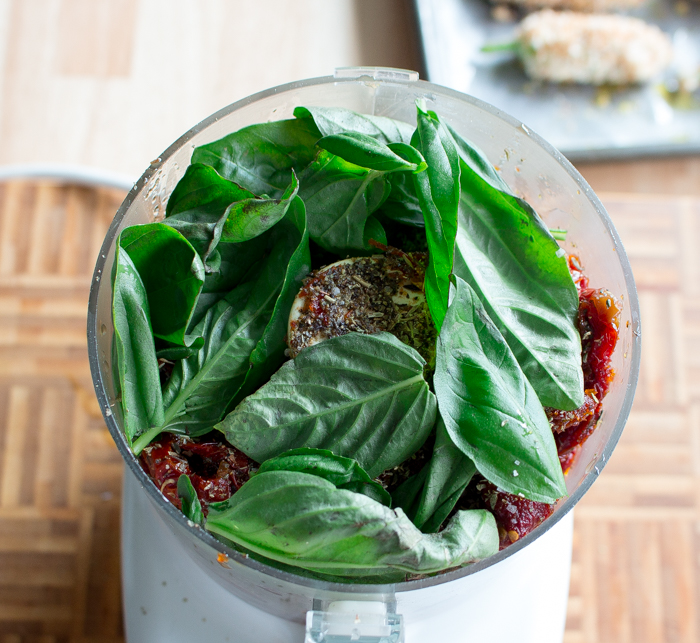 Pesto ingredients in the food processor. 