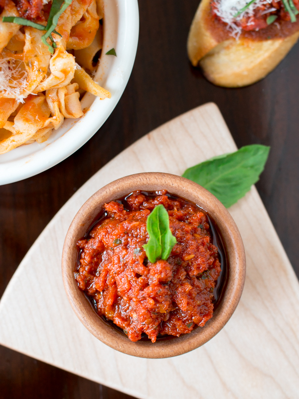 Top down photo showing the rich and delicious pesto garnished with basil leaves. 