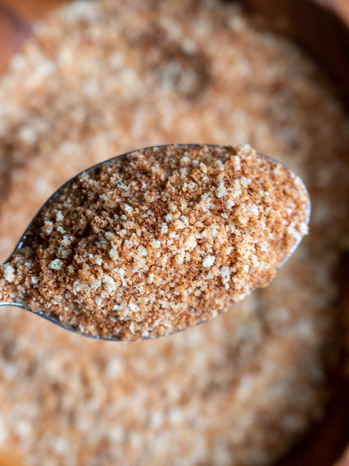 Toasted panko bread crumbs in a spoon.