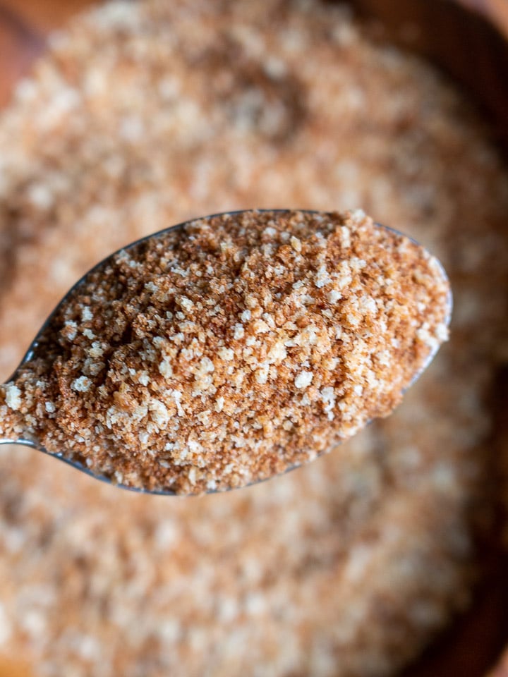 Toasted panko bread crumbs in a spoon.