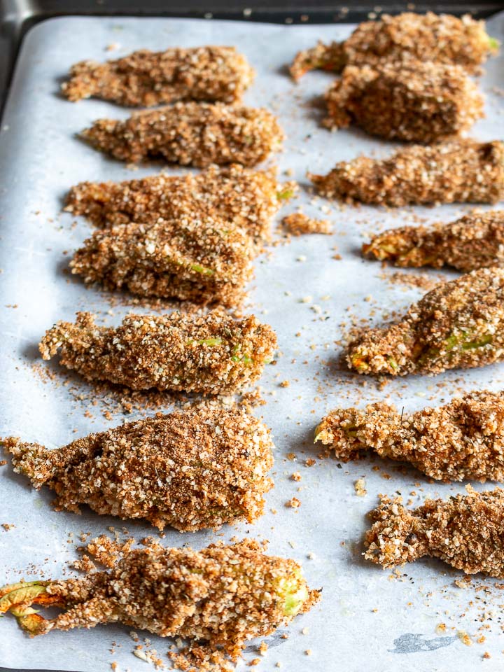 Ready to bake stuffed zucchini flowers.