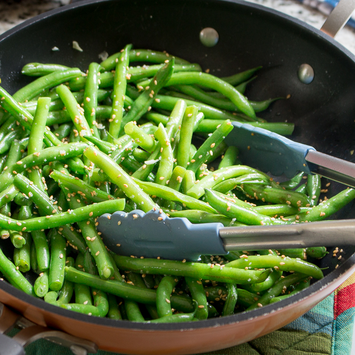 Green Beans and Sesame seeds stir frying in pan