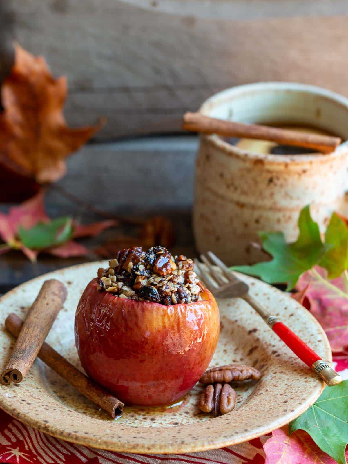 Fresh warm baked apple on a beige plate without any whipped topping.