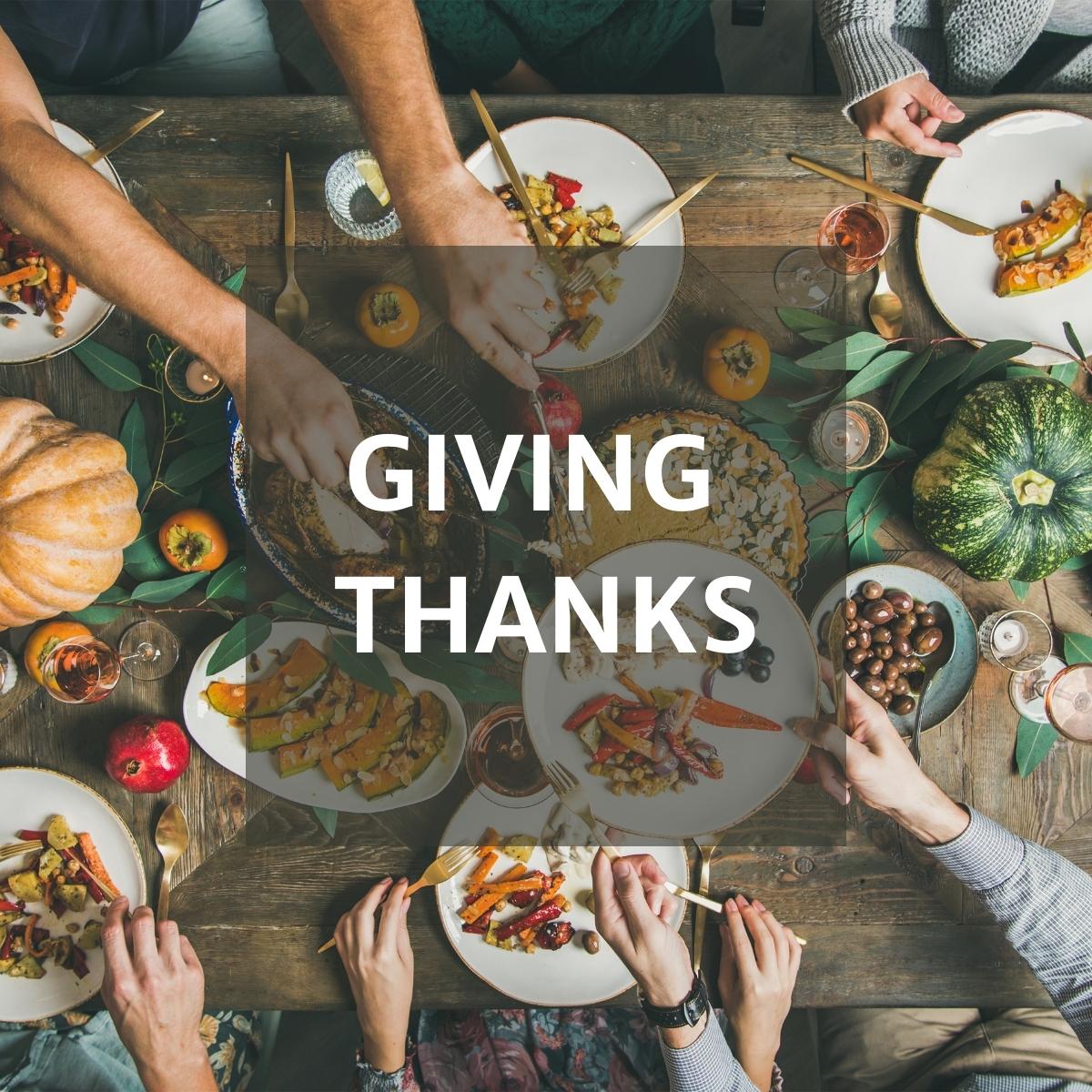 People sitting down to thanksgiving dinner.