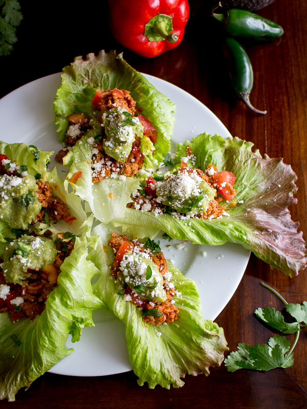 Top down photo of 5 turkey taco lettuce wraps with jalapeno and 