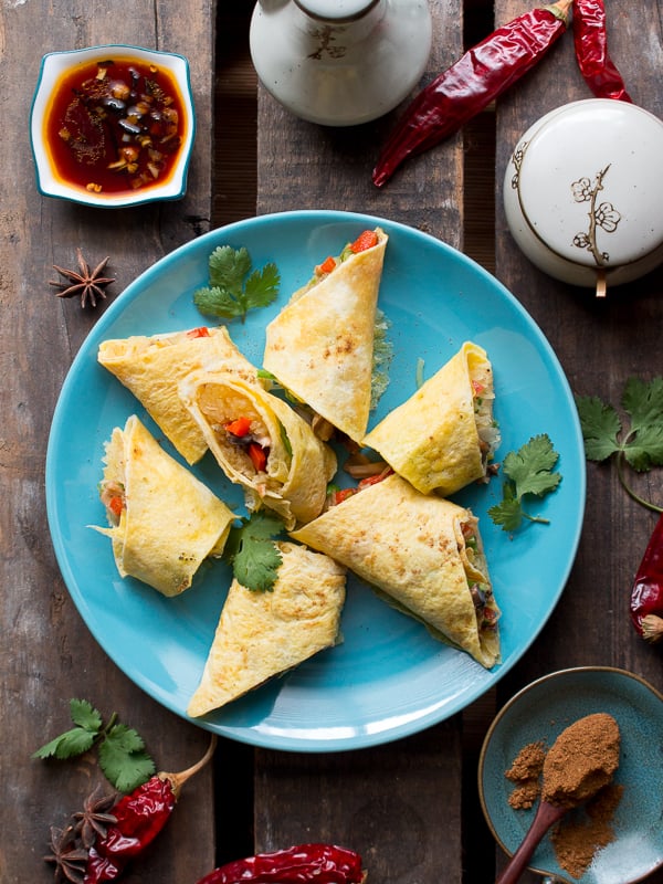 Long top down photo with Skinny Spaghetti Squash Egg Roll Ups and spicy dipping sauce