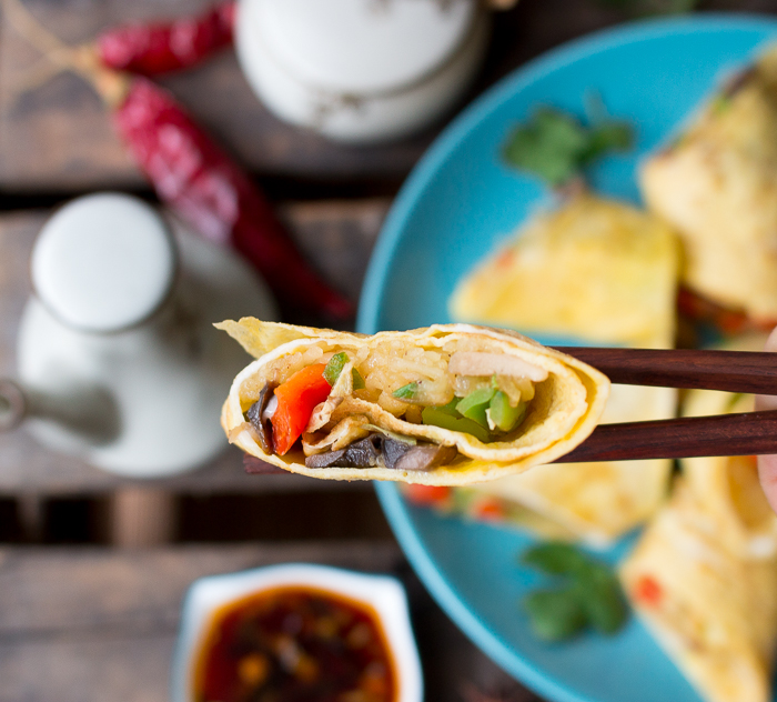 Skinny Spaghetti Squash Egg Roll Ups the bite shot with chop sticks