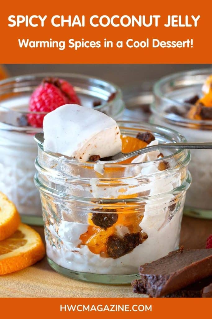 Spicy Chai Coconut Jelly in a glass jar with a scoop on a spoon.