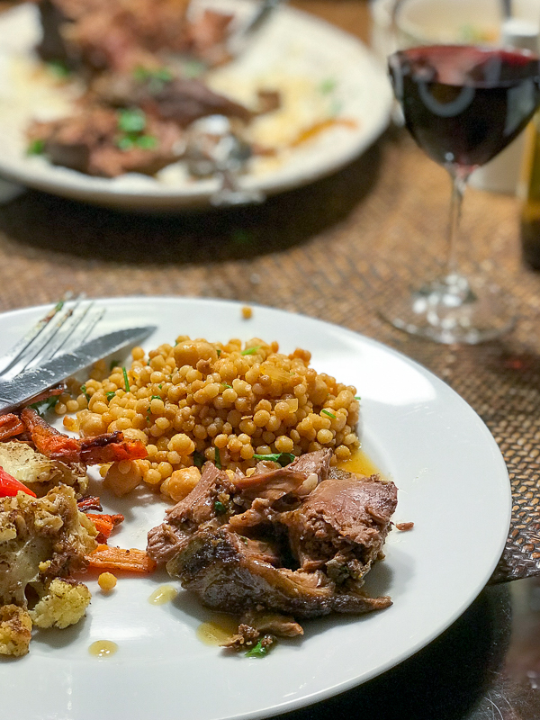 Leg of lamb meal served with red wine