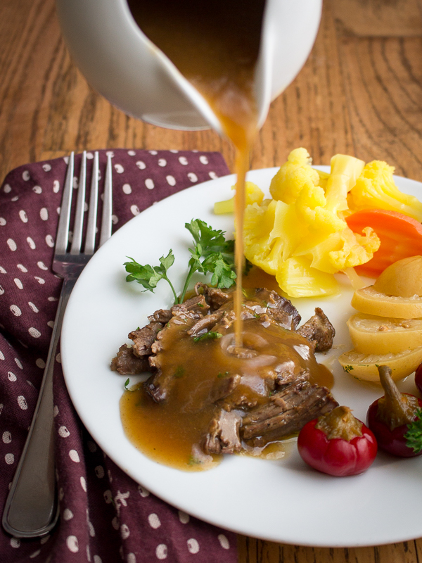 Golden Moroccan spiced Sauced gravy poured over slow roasted leg of lamb