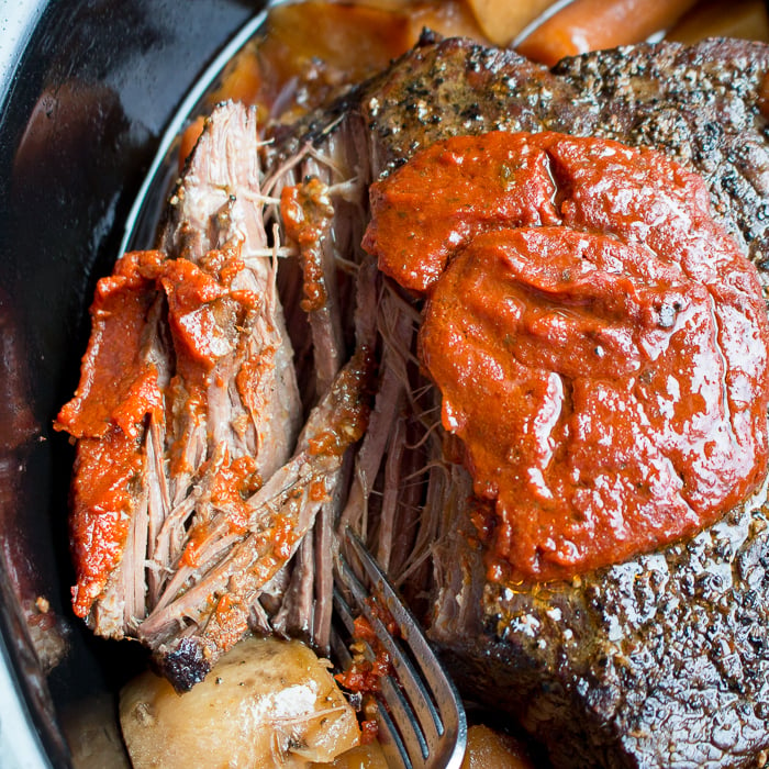 Crazy Easy Italian Slow Cooker Pot so tender it falls apart with a fork.