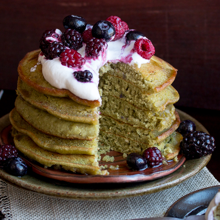 Stack of 5 pancakes cut into showing the green matcha.