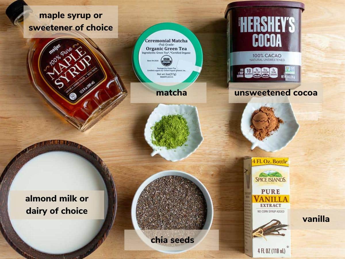 Ingredients to make a layered chocolate and matcha chia seed pudding laid out on a wooden table.