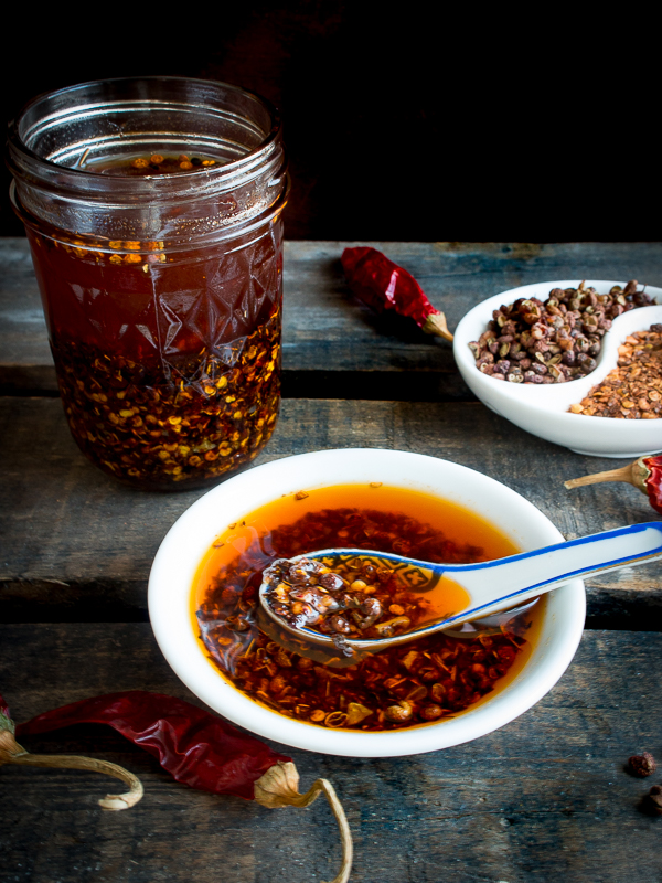 Homemade Sichuan Garlic Chili Oil in a bowl and in a canning jar.