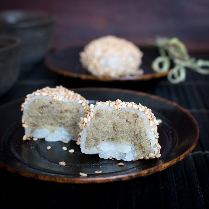 Cut in half mung bean desserts showing the filling.