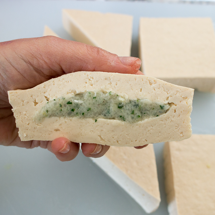 Shrimp Stuffed into the tofu triangles. Ready to be poached in the soup.