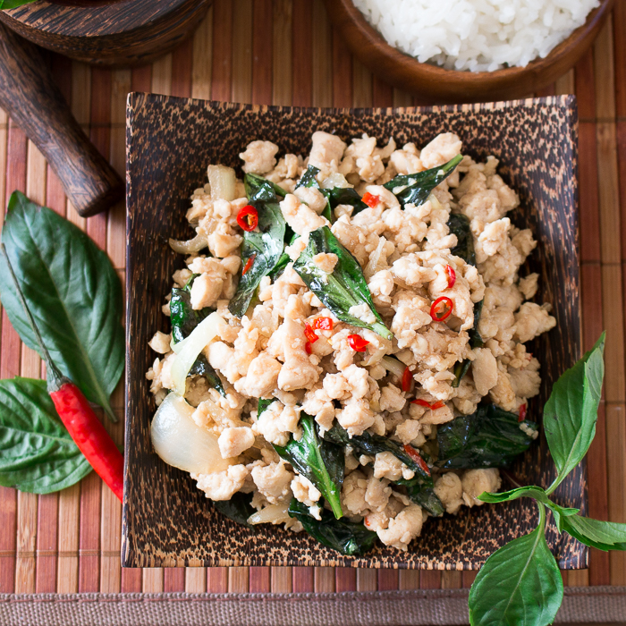 Pad Krapow Gai with riceon wooden bowl.