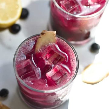 Blueberry mocktails with lemons and blueberry garnishes.