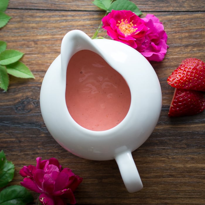 Strawberry rose dressing pretty pink and creamy in a white serving container.