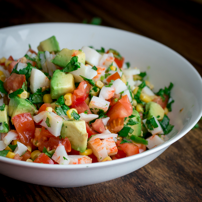 Summer crab salsa in a white bowl.