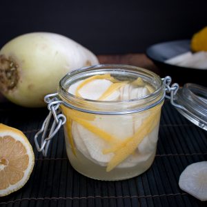 Lemon Daikon Radish Refrigerator Pickles in a glass jar.