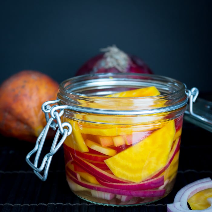Refrigerator pickled golden beets in a glass canning jar.