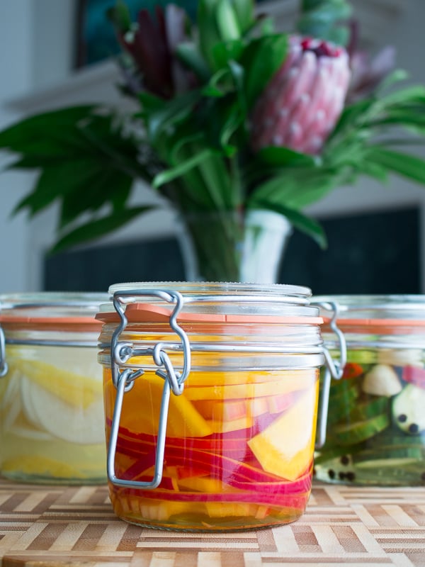 Refrigerator pickled beets showing the thin sliced of red onion. 