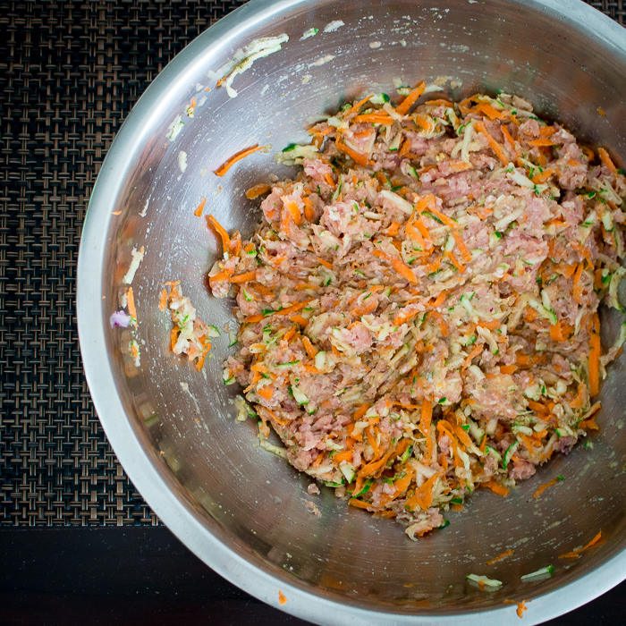 A bowl of the mix of turkey with all the vegetables mixed together before they are made into patties.