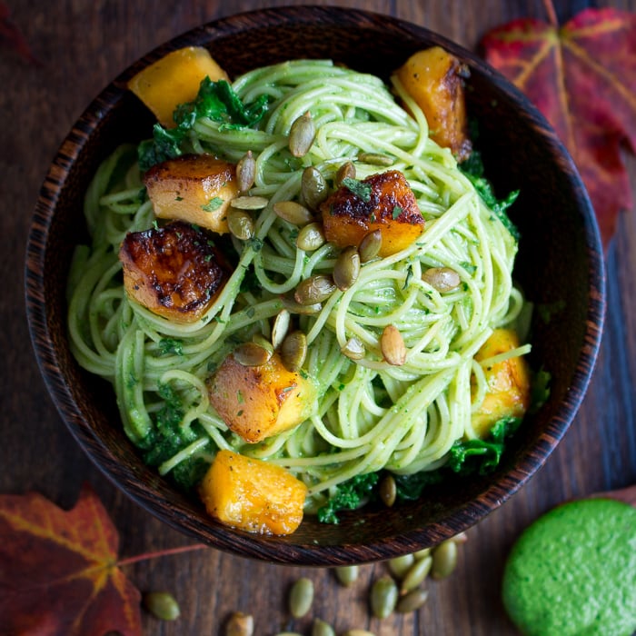 One Pot Creamy Kale Pesto Pasta topped with roasted pepitas.