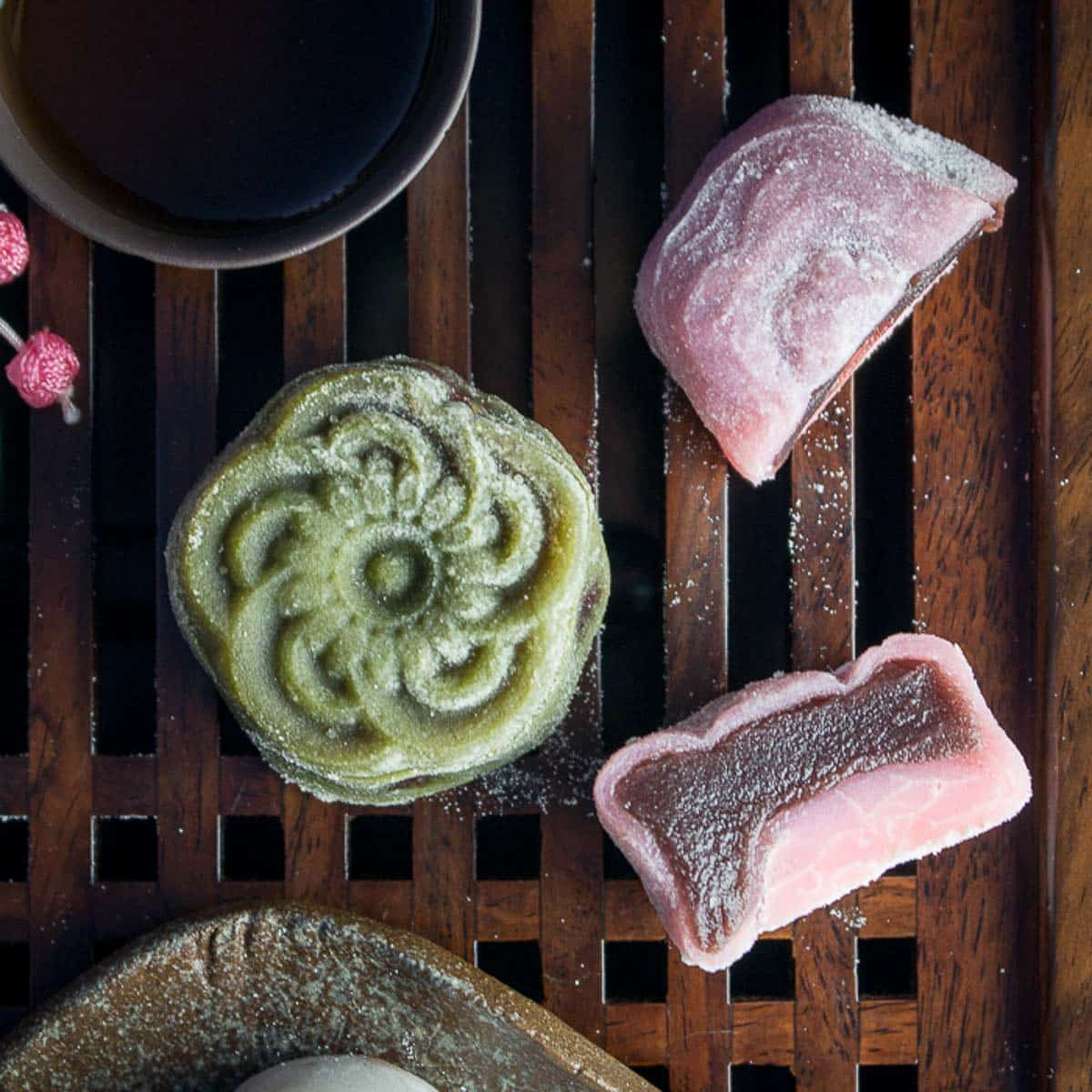 Snowy mooncake cut in half showing he delicious  sweet red bean paste. 