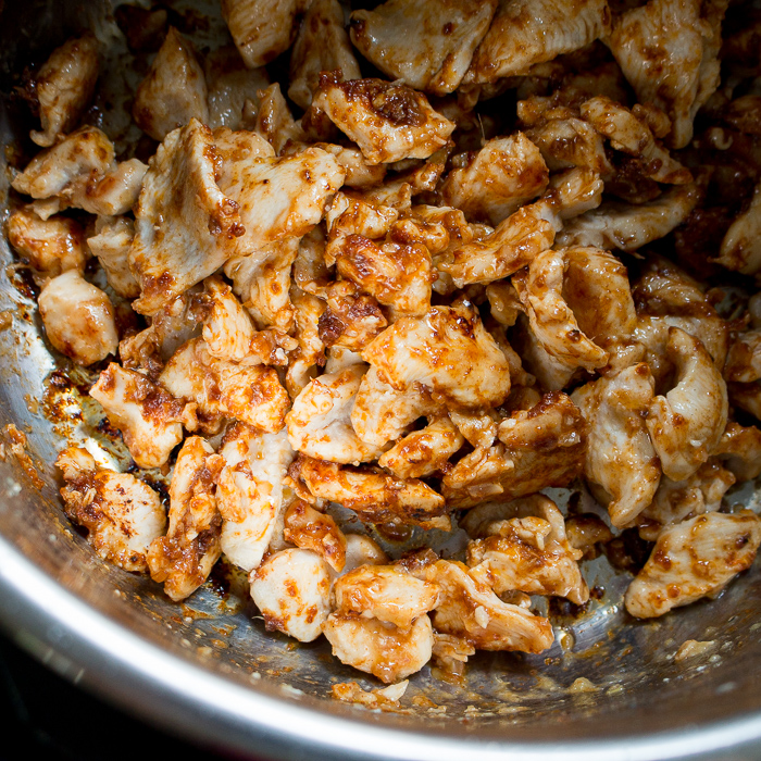 Sautéing the chicken in the instant pot. 