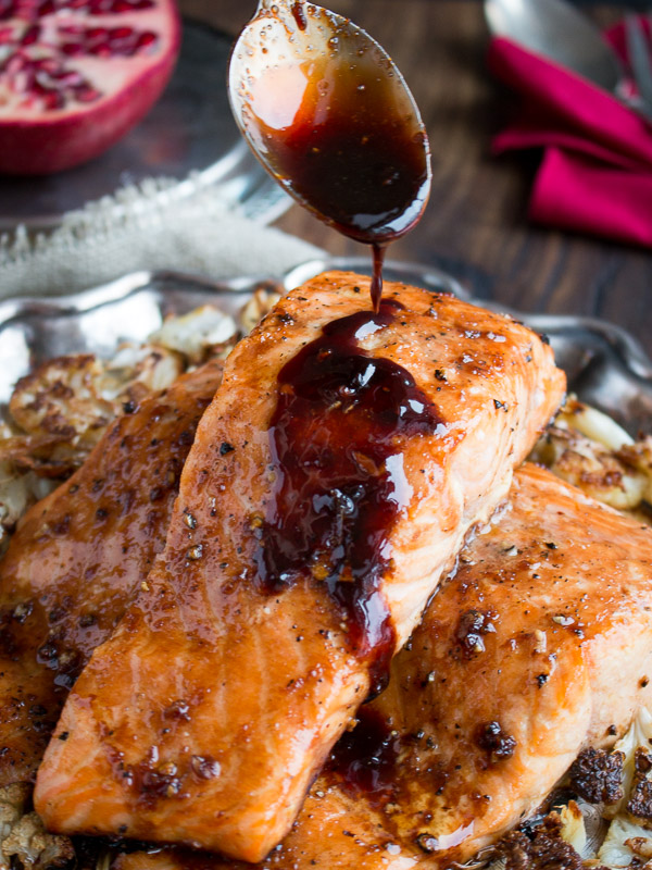 Pomegranate Glaze getting spooned over the salmon. 