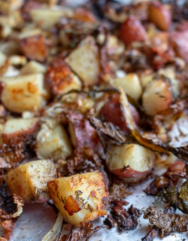 Crispy Roasted Red Potatoes and Cabbage baking in a sheet pan.