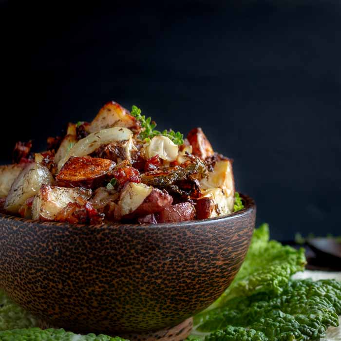 Crispy Roasted Red Potatoes and Cabbage  in a wooden bowl.