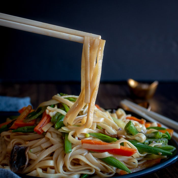 Better than Take Out Vegetable Lo Mein noodles being held by chopsticks.