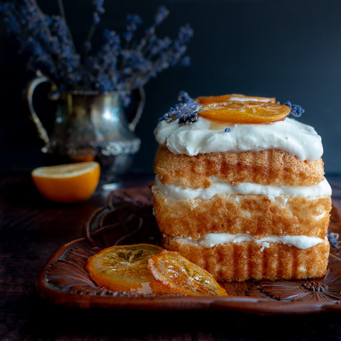 Icebox Lavender Lemon Angel Food Cake garnished with honey lemons and lavender.