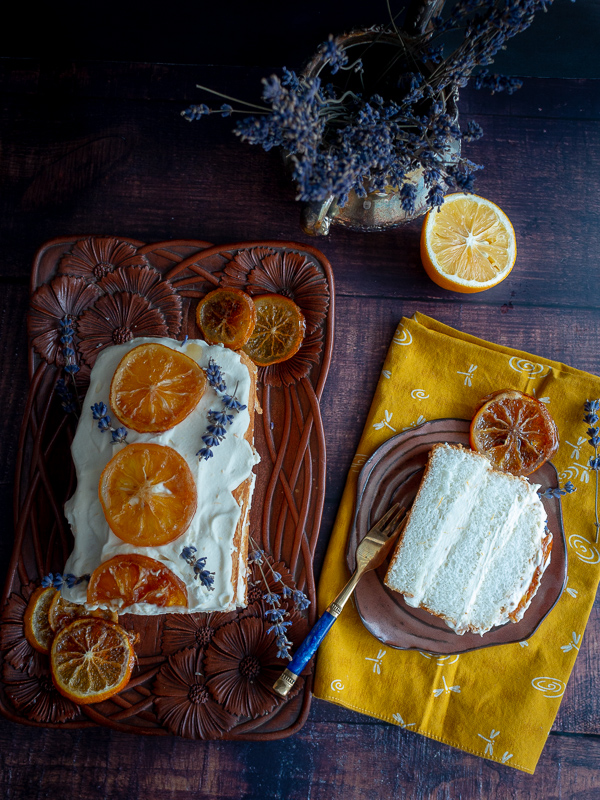 First slice of cake on a brown plate with the refrigerator cake to the left side.