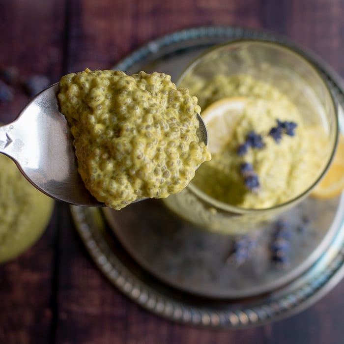 Bite shot in a spoon with thick and delicious lemony chia seed pudding.