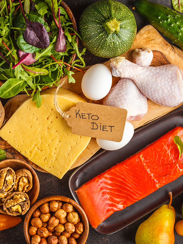 Raw keto diet ingredients on a cutting board.