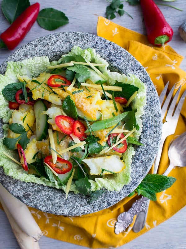 Authentic Thai Fish Salad garnished with chilies