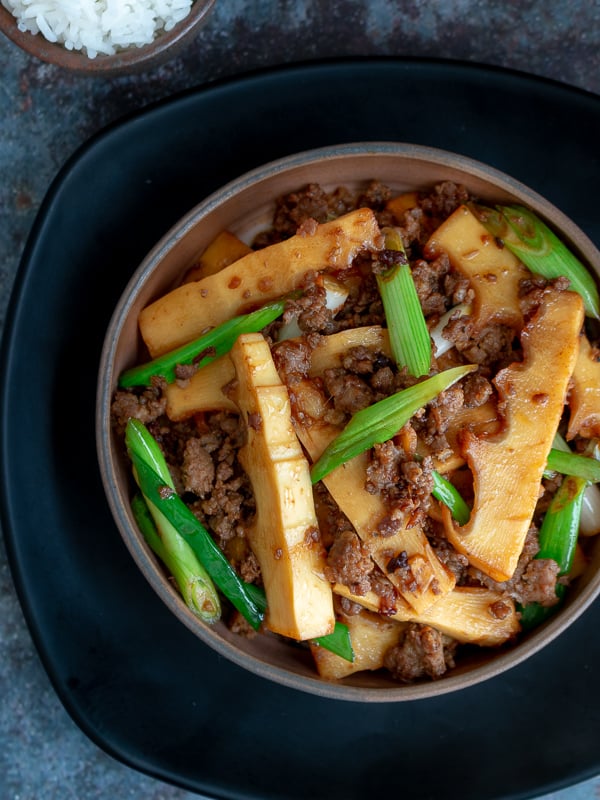 Close up shot of spicy pork and bamboo shoots top down