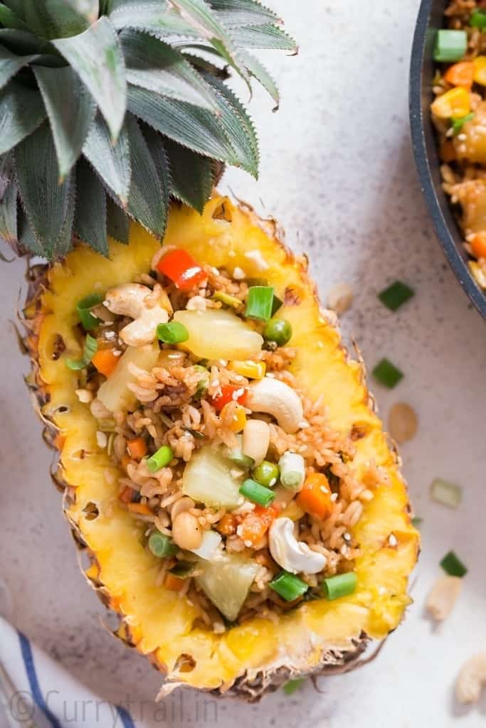 Thai Pineapple Fried rice served in half of a fresh pineapple