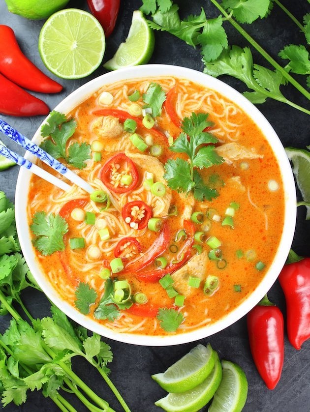 Thai red curry chicken soup with noodles and chilis