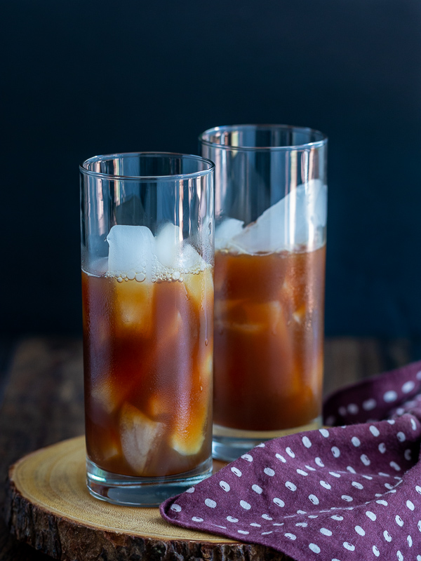 Date sweetened Masala Chai Tea poured over ice.