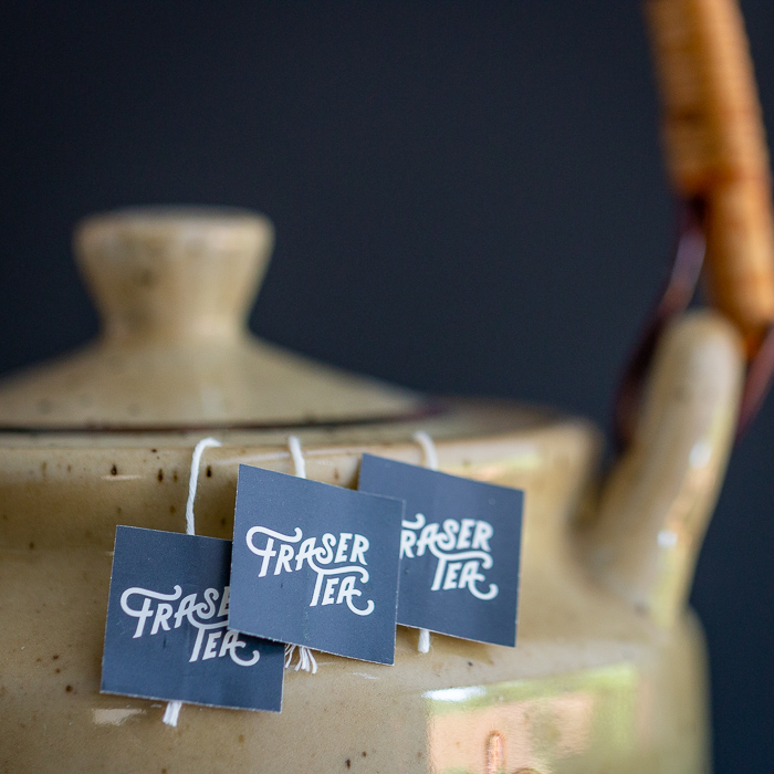 Fraser Tea sachets brewing in a tea pot.