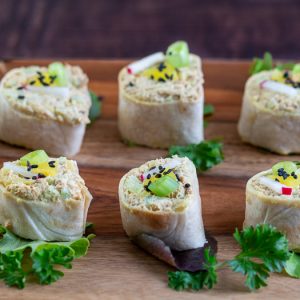 6 tuna rolls ready for guests on a plate.