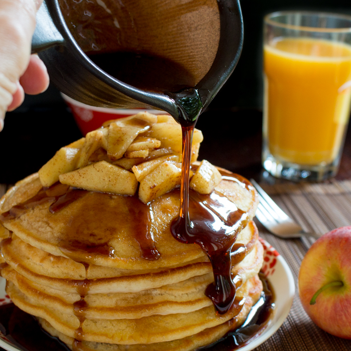 Better than Mrs. Buttersworth's Pancake syrup getting drizzled over a stack of pancakes. 