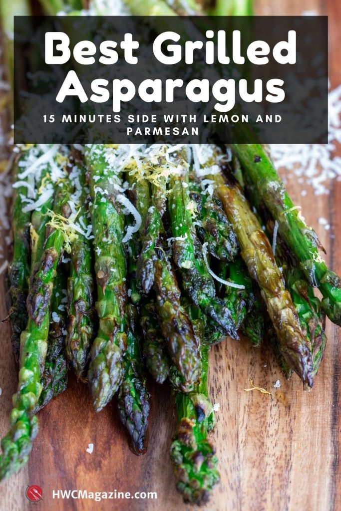 Best Grilled Asparagus on a wooden board dusted with fresh lemon zest and grated parmesan.