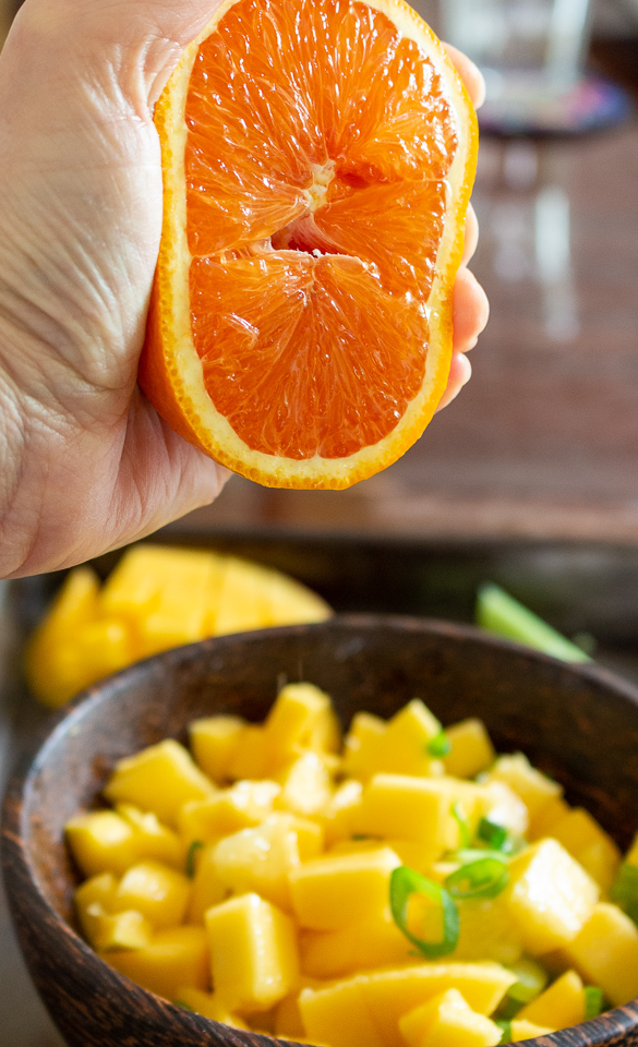 Squeezing an orange.