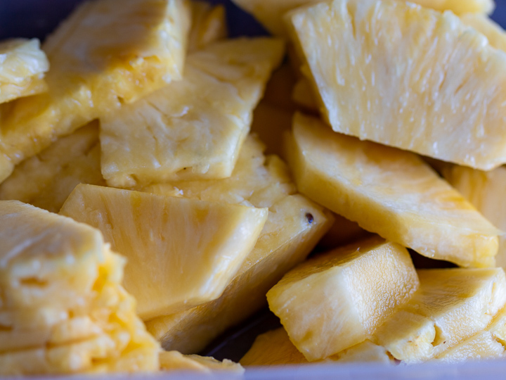 Sliced Pineapple in a tupperware ready for the refrigerator.